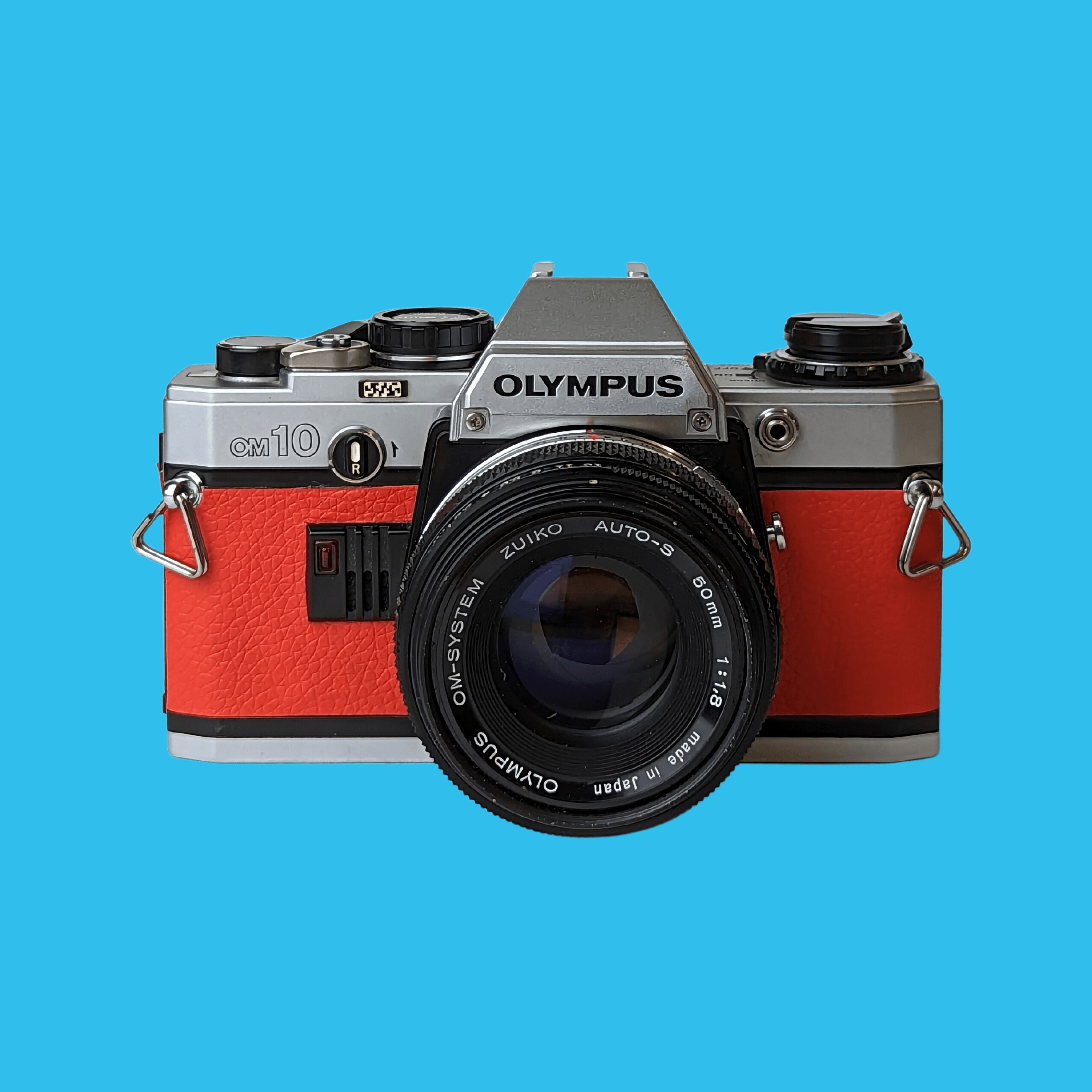 Olympe, Olympus OM10 cuir rouge appareil photo 35mm vintage avec objectif F/1.8 50mm